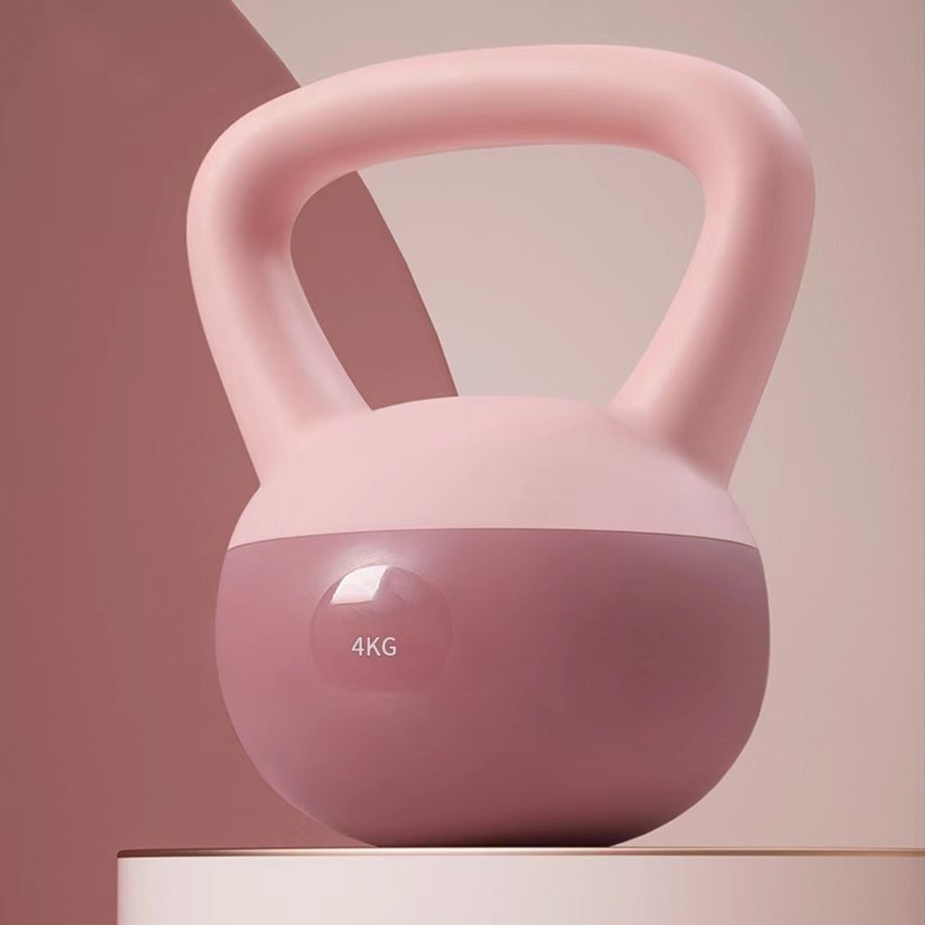 Pink kettlebell with a gradient design on a neutral background