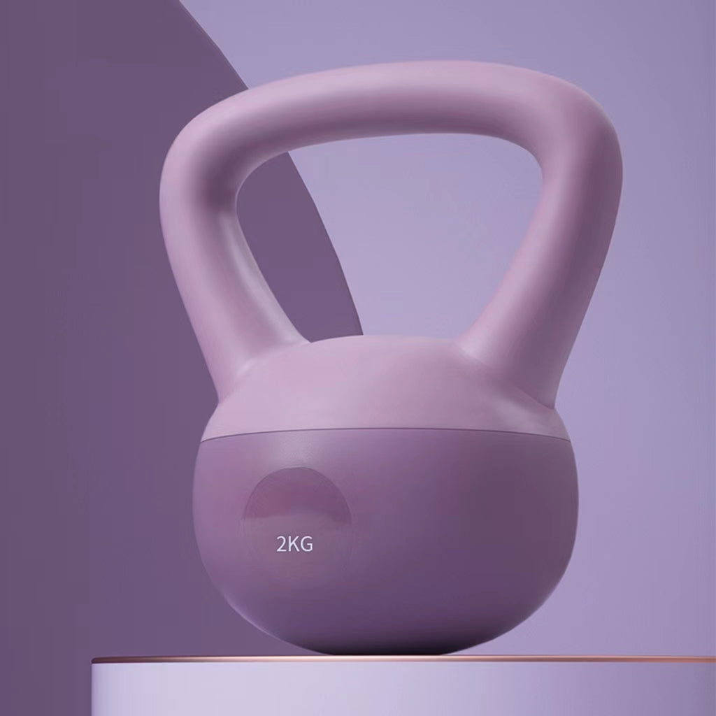 Purple kettlebell with '2KG' marking on a gradient purple background